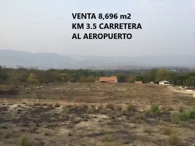 TERRENO DE 8,696 m2 PLANO A ORILLA DE CARRETERA AL AEROPUERT