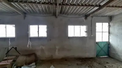TERRENO CON VIVIENDA DE LAMINA