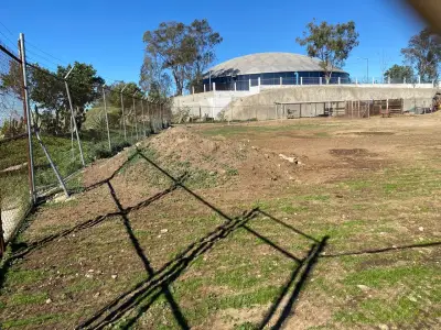 Venta de terreno de 8677 m2 con construcciones ave principal
