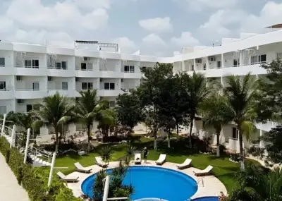 Remato departamento en suites cozumel. Sin posesión.